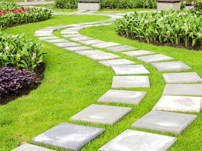 A meandering walkway among planted flower beds